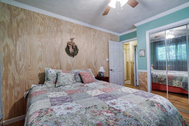 354 Fawn Rd, Pocono Lake, PA 18347 - bedroom featuring wood finished floors, crown molding, a closet, and ceiling fan