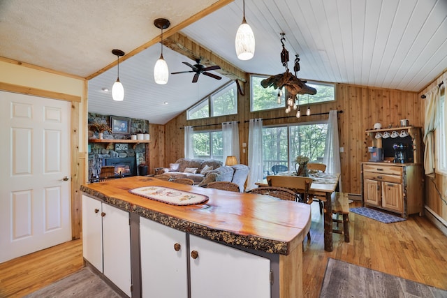354 Fawn Rd, Pocono Lake, PA 18347 - kitchen featuring wood counters, vaulted ceiling, light wood finished floors, a ceiling fan, and wood walls