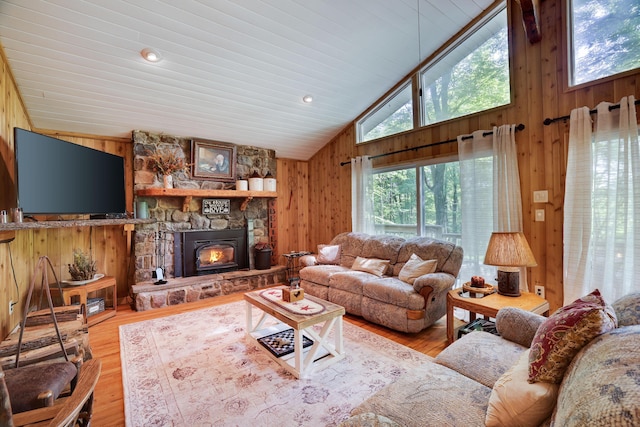 354 Fawn Rd, Pocono Lake, PA 18347 - living area with wood walls, high vaulted ceiling, wood finished floors, and a fireplace