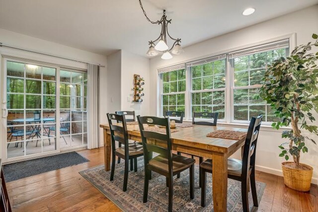 141 Beech Ln, Pocono Lake, PA 18347 - kitchen featuring appliances with stainless steel finishes, open floor plan, a center island, lofted ceiling, and wood finished floors