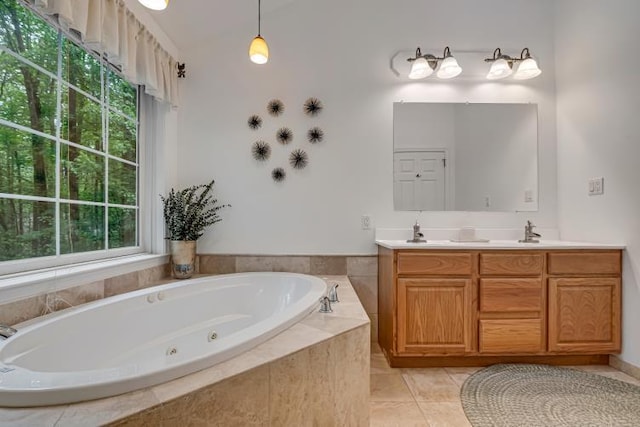 141 Beech Ln, Pocono Lake, PA 18347 - bathroom with plenty of natural light, double vanity, a tub with jets, and tile patterned floors