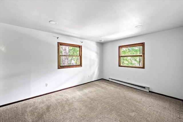 6061 Decker Rd, Bushkill, PA 18324 - unfurnished room featuring a baseboard radiator, healthy amount of natural light, and carpet flooring