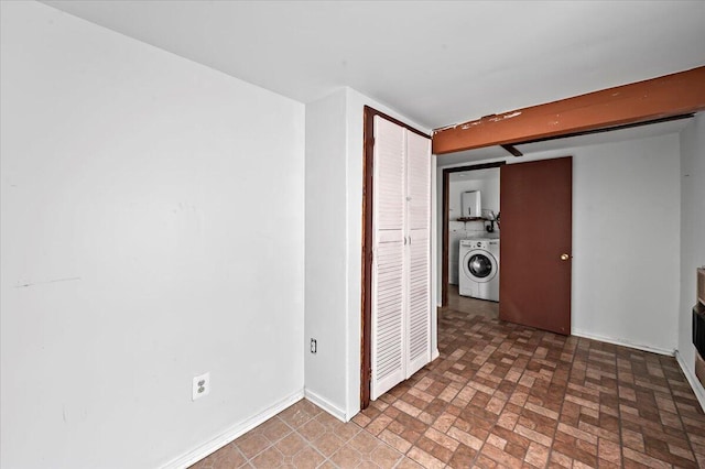 6061 Decker Rd, Bushkill, PA 18324 - unfurnished room featuring washer / dryer, baseboards, and brick patterned floors