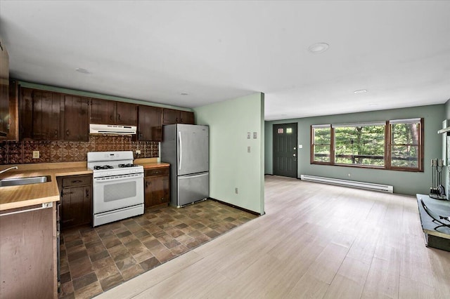 6061 Decker Rd, Bushkill, PA 18324 - kitchen with freestanding refrigerator, gas range gas stove, exhaust hood, a baseboard heating unit, and a sink