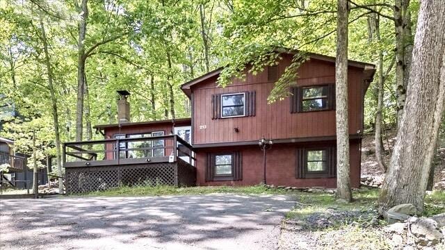 6061 Decker Rd, Bushkill, PA 18324 - chalet / cabin with a wooden deck and a chimney