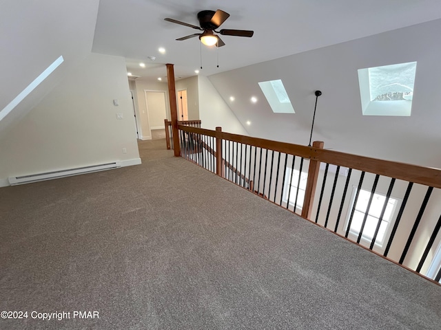 bonus room with a ceiling fan, lofted ceiling with skylight, baseboard heating, carpet floors, and recessed lighting