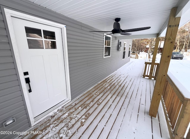 snow covered deck with a ceiling fan