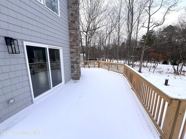 view of snow covered deck