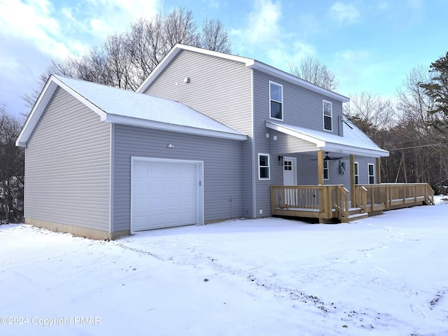 exterior space featuring a garage and a deck