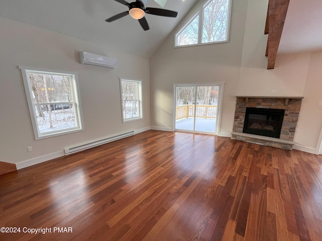 unfurnished living room featuring wood finished floors, baseboard heating, a fireplace, high vaulted ceiling, and a wall mounted AC