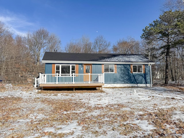 view of front of home with a wooden deck