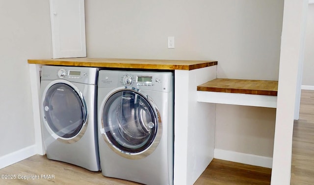 182 Mallard Ln, Albrightsville, PA 18210 - laundry area featuring light wood-type flooring, laundry area, washer and clothes dryer, and baseboards