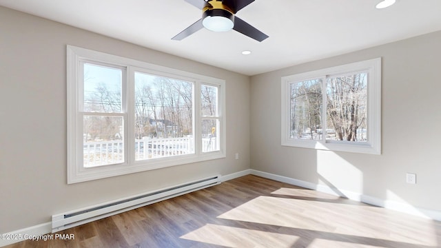 182 Mallard Ln, Albrightsville, PA 18210 - spare room with baseboards, plenty of natural light, baseboard heating, and wood finished floors