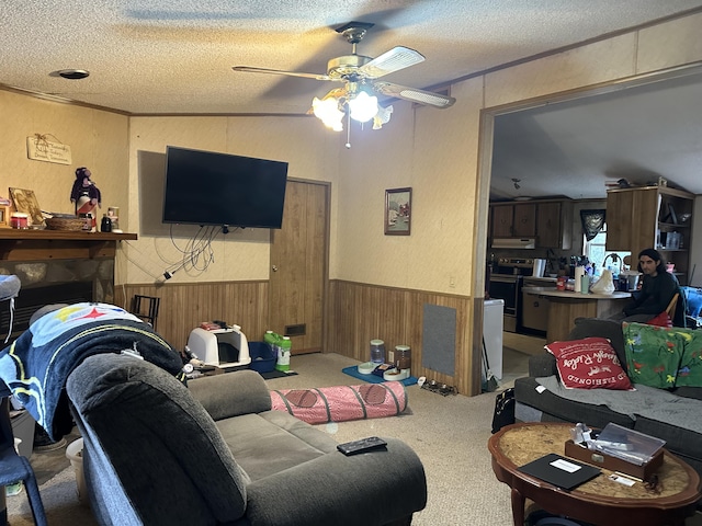 3175 Pocono Dr, East Stroudsburg, PA 18302 - living area with a ceiling fan, a wainscoted wall, a textured wall, and a textured ceiling