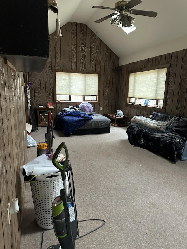 3175 Pocono Dr, East Stroudsburg, PA 18302 - carpeted bedroom featuring wooden walls, a ceiling fan, and vaulted ceiling