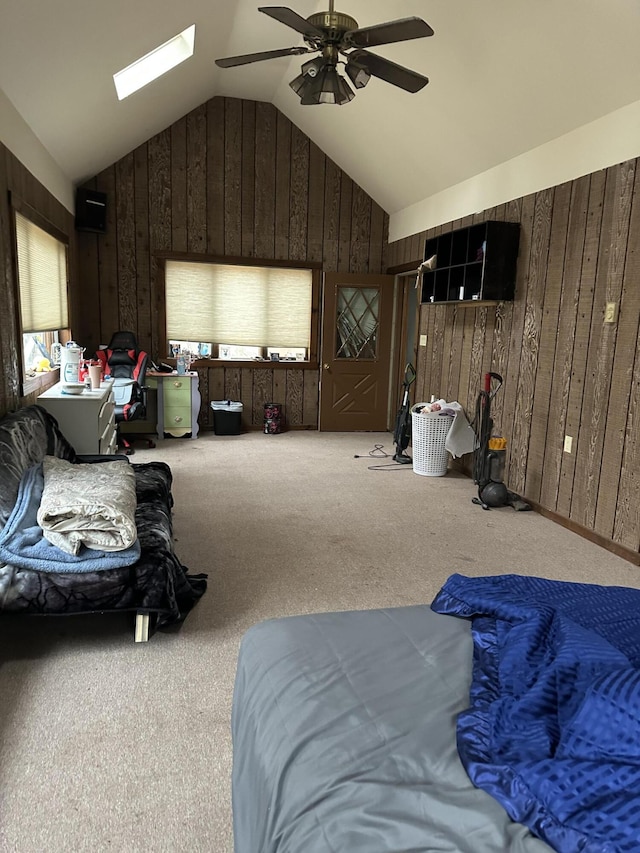 3175 Pocono Dr, East Stroudsburg, PA 18302 - bedroom featuring lofted ceiling, wooden walls, carpet floors, and a ceiling fan