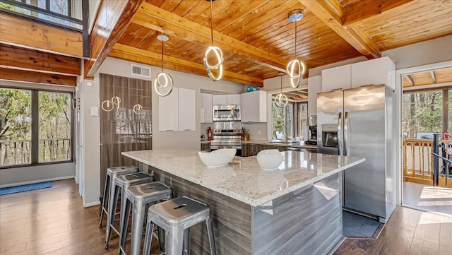 3206 Stonehenge Dr, East Stroudsburg, PA 18301 - kitchen with beam ceiling, stainless steel appliances, visible vents, dark wood-style floors, and wood ceiling