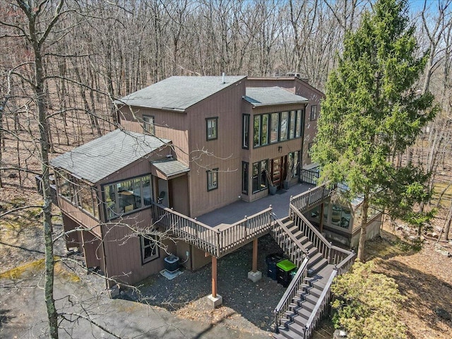 3206 Stonehenge Dr, East Stroudsburg, PA 18301 - rear view of house featuring central AC, a wooden deck, stairs, and roof with shingles