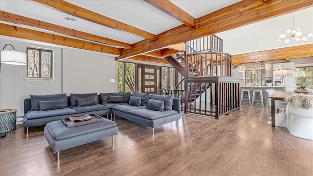 3206 Stonehenge Dr, East Stroudsburg, PA 18301 - living room with an inviting chandelier, baseboard heating, stairs, wood finished floors, and beamed ceiling
