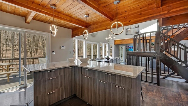 3206 Stonehenge Dr, East Stroudsburg, PA 18301 - kitchen with beamed ceiling, open floor plan, modern cabinets, dark wood-type flooring, and wooden ceiling