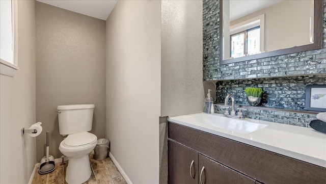 3206 Stonehenge Dr, East Stroudsburg, PA 18301 - bathroom with backsplash, toilet, baseboards, and vanity