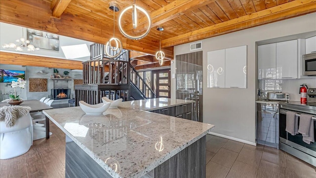 3206 Stonehenge Dr, East Stroudsburg, PA 18301 - kitchen with wood ceiling, visible vents, appliances with stainless steel finishes, beam ceiling, and white cabinetry