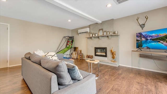 3206 Stonehenge Dr, East Stroudsburg, PA 18301 - living area with beam ceiling, an AC wall unit, baseboards, wood finished floors, and visible vents