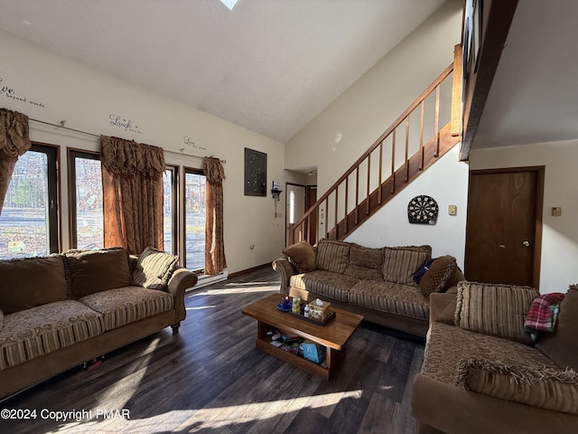 living area featuring stairs, lofted ceiling, and wood finished floors