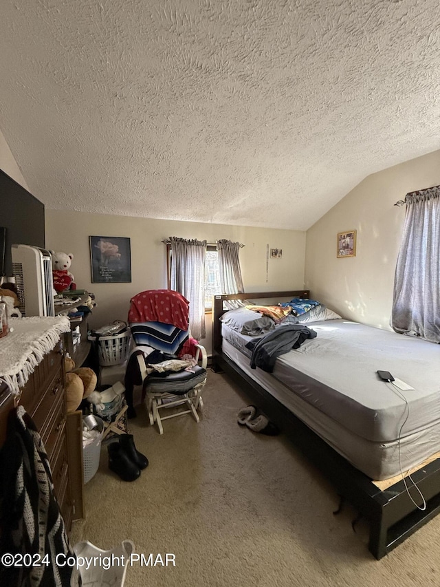 carpeted bedroom with lofted ceiling and a textured ceiling