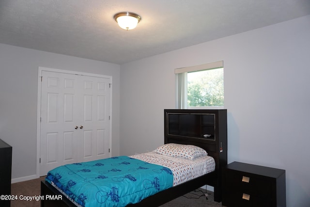 carpeted bedroom featuring a closet