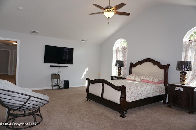 carpeted bedroom featuring vaulted ceiling and ceiling fan