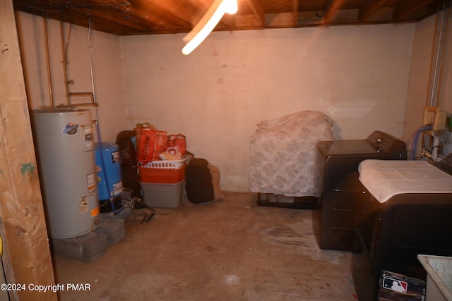 unfinished basement with independent washer and dryer and gas water heater