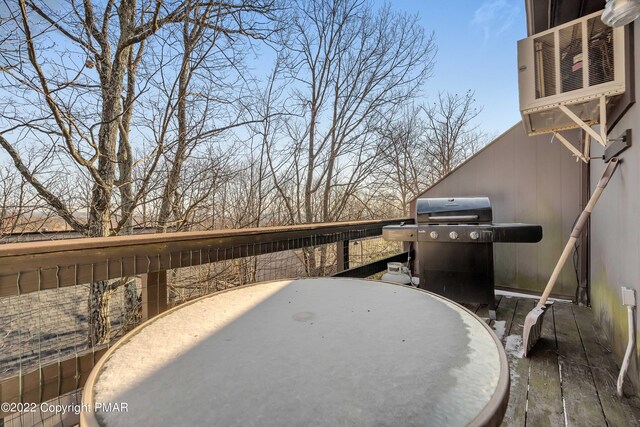 view of patio featuring a grill and a deck