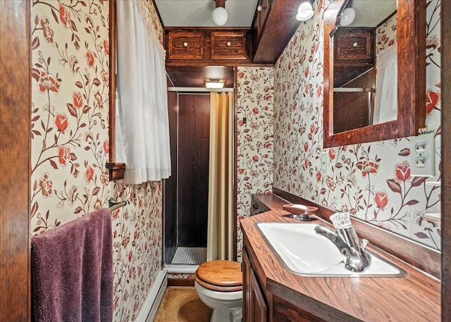 1125 Rhododendron Ln, Pocono Summit, PA 18346 - bathroom featuring wallpapered walls, a stall shower, vanity, and baseboard heating