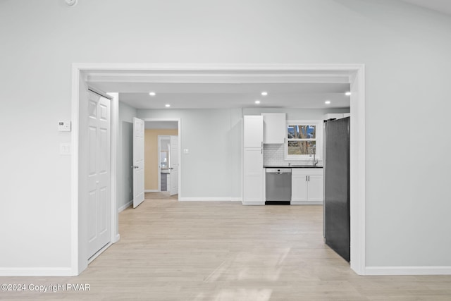 interior space featuring light wood finished floors, recessed lighting, and baseboards