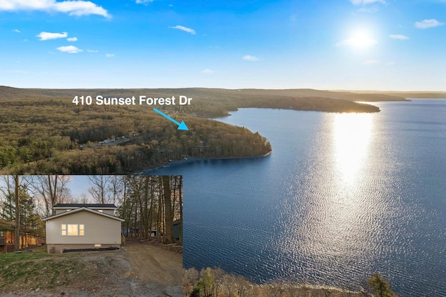 birds eye view of property featuring a water view