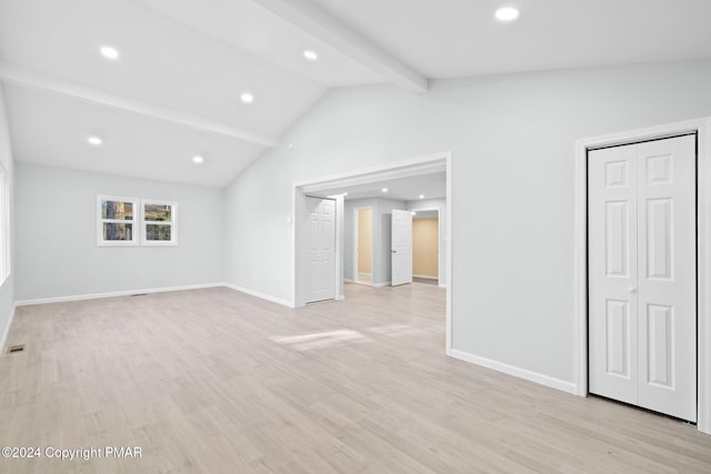 interior space featuring recessed lighting, baseboards, vaulted ceiling with beams, and light wood finished floors