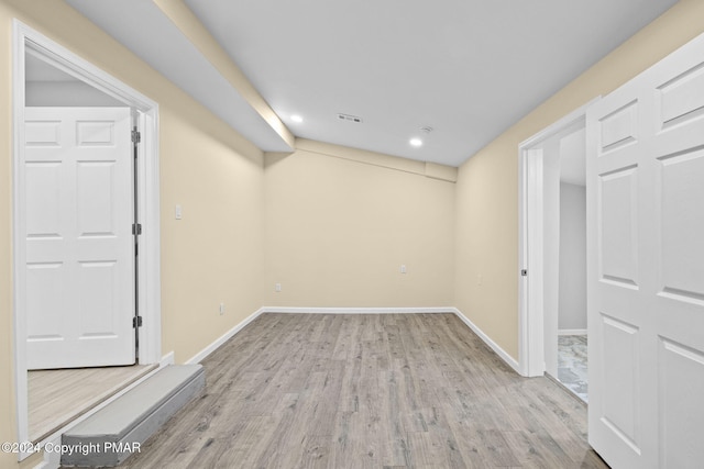 interior space featuring recessed lighting, wood finished floors, visible vents, and baseboards