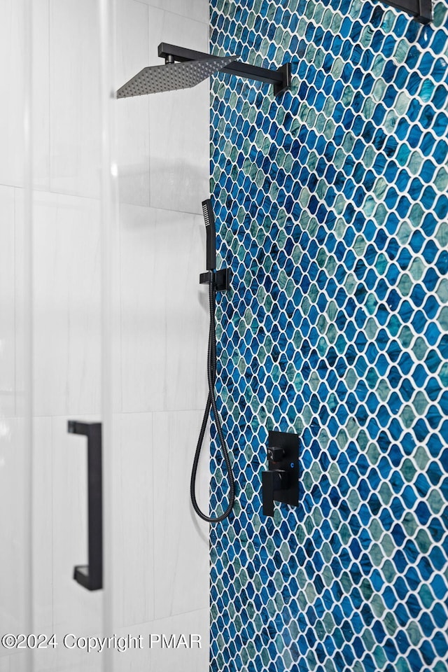 full bathroom with tiled shower