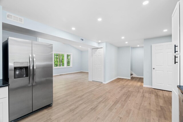 410 Sunset Forest Dr, Hawley, PA 18428 - kitchen with stainless steel fridge with ice dispenser, light wood-style floors, open floor plan, white cabinets, and recessed lighting