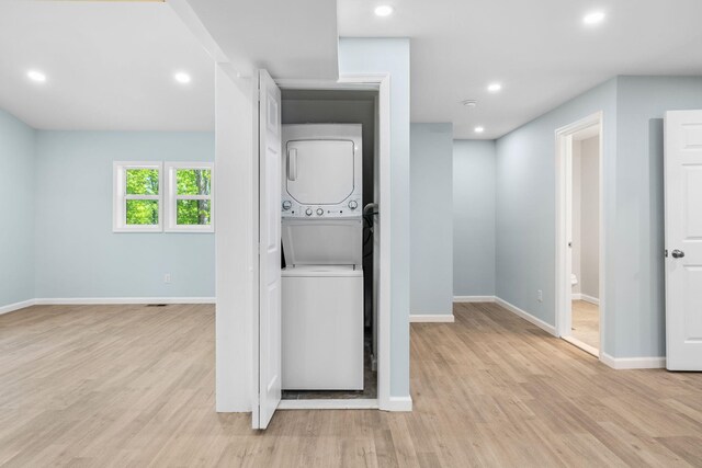 410 Sunset Forest Dr, Hawley, PA 18428 - laundry room featuring stacked washing machine and dryer, light wood-style floors, recessed lighting, and baseboards
