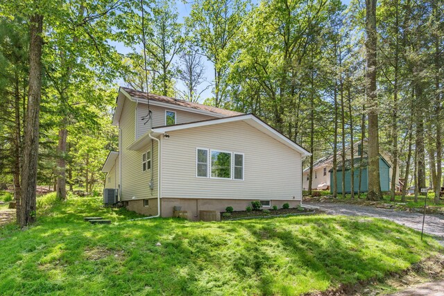 410 Sunset Forest Dr, Hawley, PA 18428 - view of side of home featuring a lawn and central AC unit