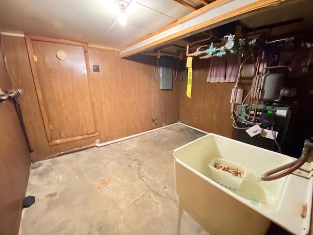 finished below grade area with a sink and electric panel