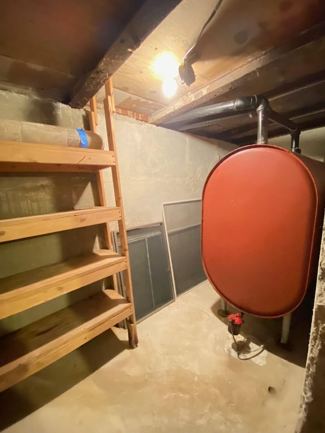 unfinished basement featuring heating fuel