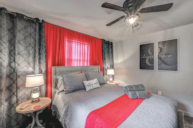 bedroom featuring ceiling fan and carpet flooring