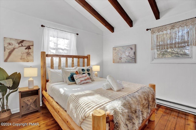 bedroom with vaulted ceiling with beams, hardwood / wood-style flooring, and a baseboard heating unit