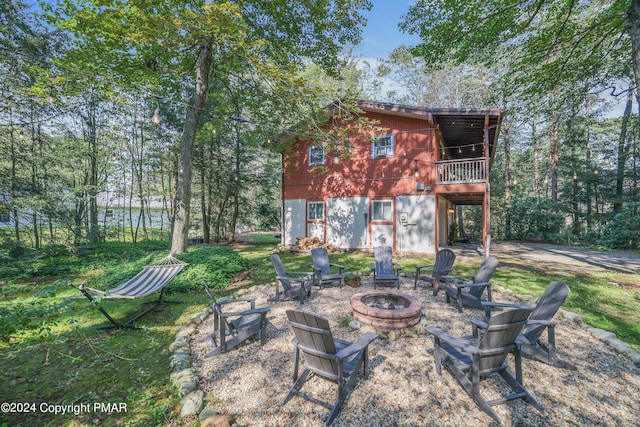 view of yard featuring a fire pit and a deck