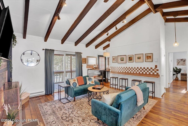 living room with high vaulted ceiling, baseboard heating, wood-type flooring, and beam ceiling