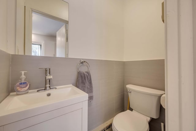 130 Cross Country Ln, Tannersville, PA 18372 - bathroom with toilet, vanity, tile walls, and wainscoting