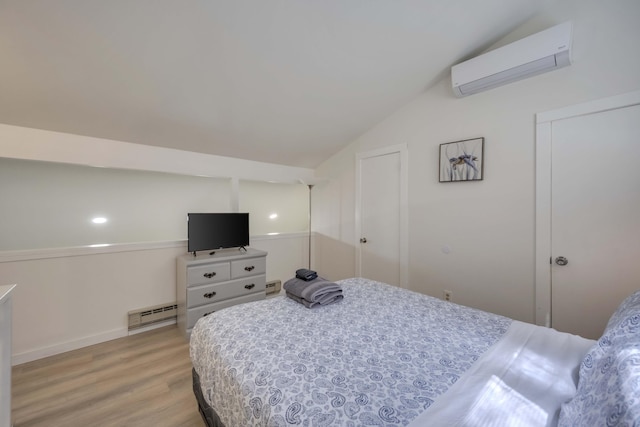 130 Cross Country Ln, Tannersville, PA 18372 - bedroom with a wall mounted AC, vaulted ceiling, light wood-style floors, a baseboard heating unit, and baseboards